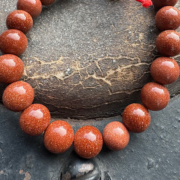 goudsteen rood synthetisch armband kralen sieraad